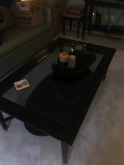 Wood with glass coffee table which also has additional matching pieces available!