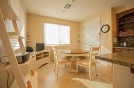 kitchen table with 4 chairs and media cabinet.