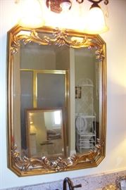 One of a pair of mirrors in master bath