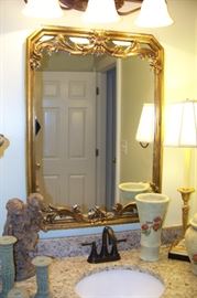 One of a pair of bathroom mirrors