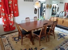 Gorgeous Scandinavian Danish Teak Dining Room Table with 2 leaves and 6  'Eva' chairs by Niels Koefoed. This vintage, mid-century modern furniture was made in Denmark and purchased from International Design Center in Minneapolis between 1967-1969. This solid wood table has 2 leaves, which when inserted creates a beautiful wood contrast on the tabletop. The 'Eva' chairs by Niels Koefoed alone are selling for thousands of dollars online.The table is approximately 73" L X 41.5" W X 28.5" H. Each of the 2 leaves is 19" W, adding an additional 38" of length to the table, for a total of 111" of length with both leaves inserted.
Please see lots 1B, 17, 26A, 107, and 117 for more International Design Center Danish Teak furniture! Please bring proper tools to disassemble and help for removal.
***REMOVAL DAY FOR THIS ITEM IS THURSDAY, MARCH 14th FROM 10:00 A.M to 2:00 P.M ONLY.  PLEASE BE SURE TO READ INFORMATION LOT "0" FOR SPECIAL REMOVAL INSTRUCTIONS ON THIS ITEM***