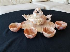 Hand made authentic Chinese rose quartz tea set. Tea pot, platter, and 4 tea cups are included. Base plate is approximately 10" L X 8" W.