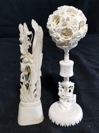 Vintage Carved Chinese puzzle ball with stand. Intricately carved puzzle ball has a minimum of 8 concentric balls enclosed within itself. Diameter is approximately 2.5". Stand is 6" tall. Additional statue is 8" tall and appears to made out of bone. Please see pictures to inspect and determine actual materials of items.