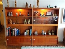 Vintage Scandinavian Danish Teak, mid-century modern Bookcase. This was purchased from International Design Center in Minneapolis between 1967-1969. Bottom sliding cabinet drawers, sliding glass display area with glass shelf, and four narrow, dovetailed drawers across the middle. Size of bookcase is 92.5" W X 15.5" D X 68" H. Contents not included.
This piece is one complete unit. This will need to be disassembled in order to be removed from the condo, as it will not fit around corners, through the door, and down the elevator, as it is. The shelves appear to be slid on runners and held in place by nails on the back. As you can see, there is only one center support, so one side of the bookcase will most likely need to be disassembled, and then you may be able to leave the other side intact for removal. We are not exactly sure how this piece is to be disassembled, as the edges and attachment points are smooth/hidden, until you start uninstalling from the back. Please view all pictures, a