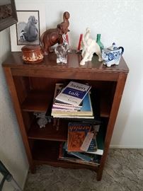 Small cabinet with assorted books