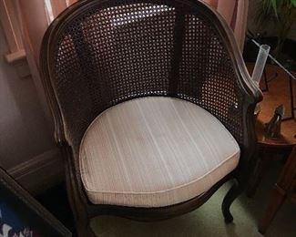  One of two wicker back chairs with cushion seat