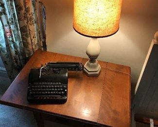Antique typewriter on top of dropleaf table