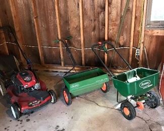 Toro lawn mower and two seed spreader’s