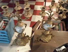 pair of beautifully ornate candelabras made of metal and porcelain