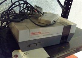 Nintendo gaming console.  untested.  there is a Super Mario game inside. has 2 controllers. 