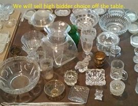 We were selling whole tables of stuff like this for 2 bucks at our last sale.  It's all gotta go.   There are 4 tables loaded with glass in this auction. 