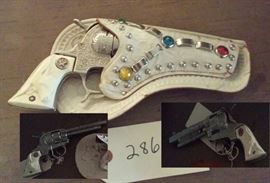 awesome old Hubley Texan cap gun with white jeweled holster, longhorn grips. fires nicely.  no breaks or cracks. 