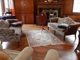 PAIR OF CAMELBACK SOFAS AND RUGS