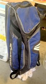 Well-used Easton girl's rolling softball bag