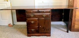 Solid Pine Sewing Table/Cabinet with 2 drop-down leaves, 5 drawers and area for portable sewing machine storage; Cabinet is 28-1/2" wide x 25" deep x 29" high; Each side extends 22".