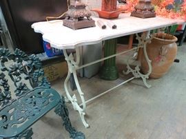 Antique cast iron table base and marble top