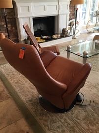 German recliner, real light brown leather, need new hydrolic system to electrically recline. Repair man contact available. 