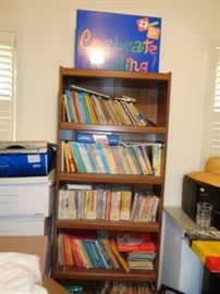 Teachers Home Office stuffed with Young Childrens Books ( maybe grades 1 to 4) and teacher room supplies