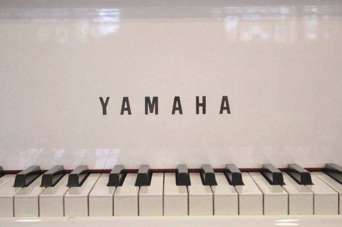 White Yamaha Baby Grand Piano
