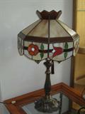 Beautiful stained glass table lamp with red accent flowers! Will complete any table in your home perfectly! Must see!