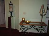 Buffet table! Wrought black iron bottome, wood trim with glass top! Excellent condition! There is also a matching end table!