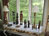 Wood detailed buffet table with marble top! Table lamps and wooden figures!
