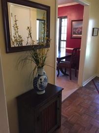 Green cabinet, mirror, flower vase