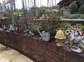 Garden art, garden art, garden art.  There are also 11 cement bunnies for sale nestled in the greenery around the pool.  