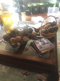 Cherry and glass oversized coffee table with all the required decor.  Fabulous silver-look tray with antlers and candle hurricane.  