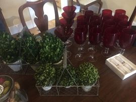 Beautiful red glassware and garden decor. 