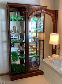 The second of three beautiful slide front lit glass display cabinets