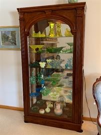 The third of three beautiful slide front lit glass display cabinets