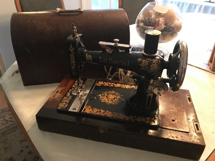 Antique Lit Special electric sewing machine. With wood case