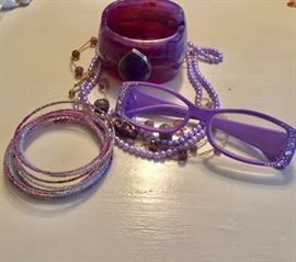 Purple tone jewelry and glasses 