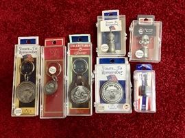 Pewter souvenir keychains and thimbles