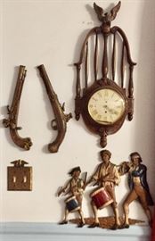 Sexton metal pistol and marching Patriots wall hangings and wall clock