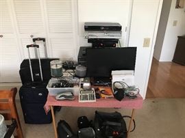 Working tv, DVD players, blue ray players, suitcases