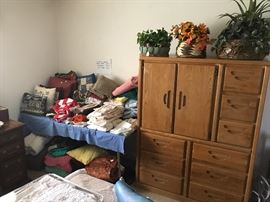 Towels, pillows and dresser