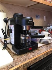 Kering Expresso machine with dishes