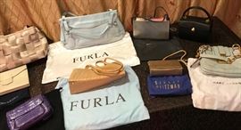 Designer handbags including Nancy Gonzales, Furla, Stuart Weitzman, Marc Jacobs, Oscar de la Renta, Mercedes Benz Seatbelt bag, Wendy Stevens and Landau