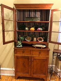 antique pine step back cupboard filled with Majolica