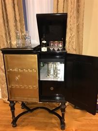 black lacquer lighted bar cabinet , open