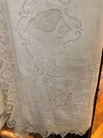 lots of beautiful lace  & cutwork tablecloths
