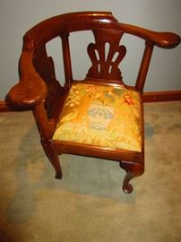 19th century corner chair wearing antique textile