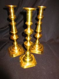 Group of antique brass candlesticks