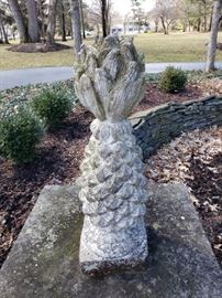 One of  a pair of cast concrete pineaples