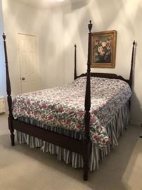 Four poster bed with linens