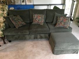 Comfy sofa with matching ottoman and 5 toss pillows.