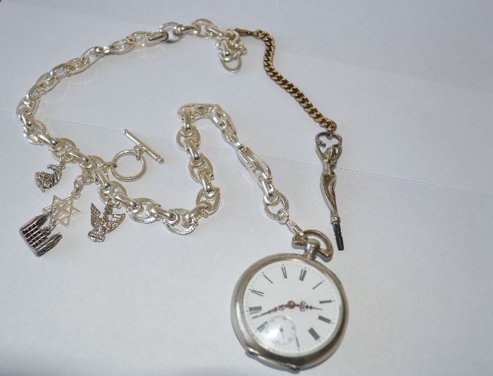 Sterling key-wind pocket watch with nude lady key plus sterling chain and charms