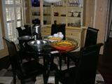 Glass top dining table, set of chairs.